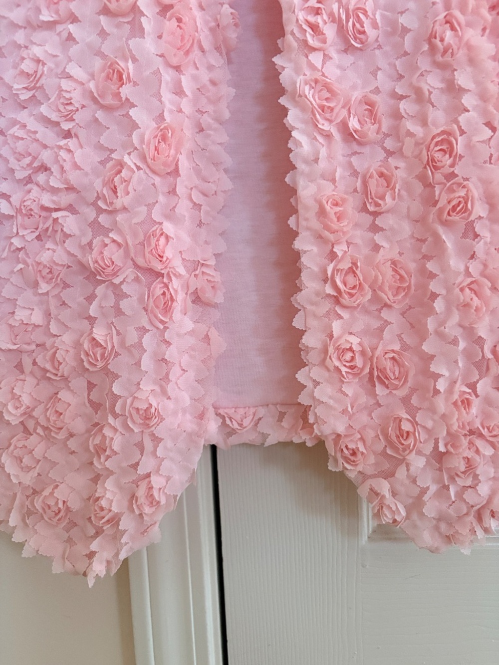 A pink 3D rosette textured short-sleeve top. - Picture 2 of 4